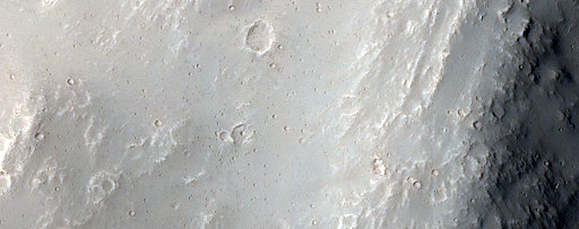 Possible Layered Bedrock Exposed in Perrotin Crater