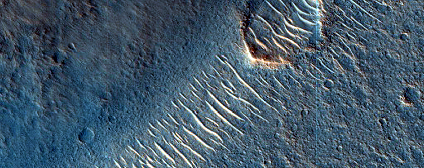 Layers Exposed around Streamlined Feature in Ares Valles
