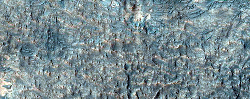 Light-Toned Layered Deposits on Northern Edge of Hellas Planitia