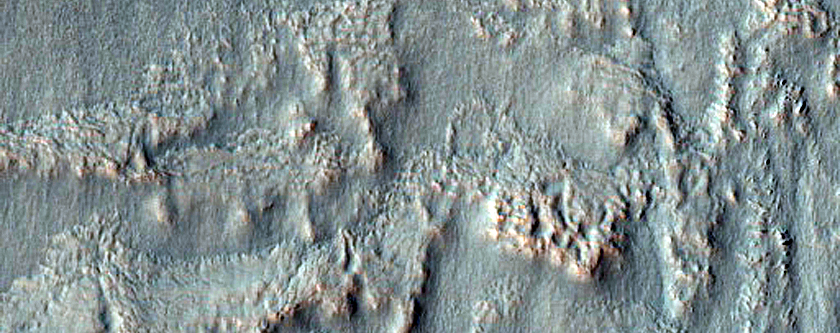 Triangular Scars on Hillslopes
