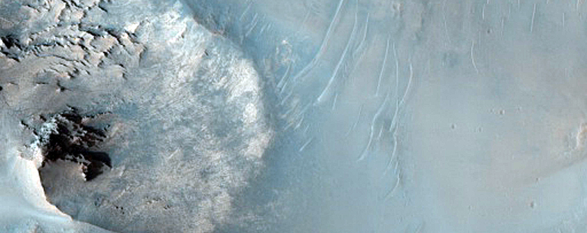 Layered Bedrock and Bedforms in Flaugergues Crater