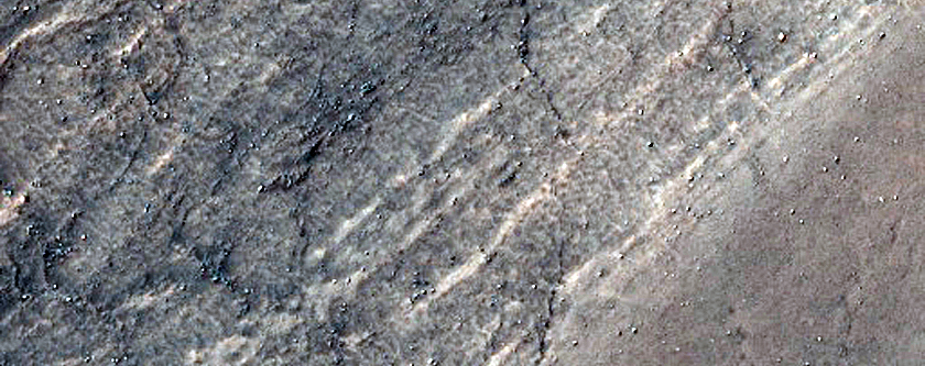 Triangular Scars on Hillslopes