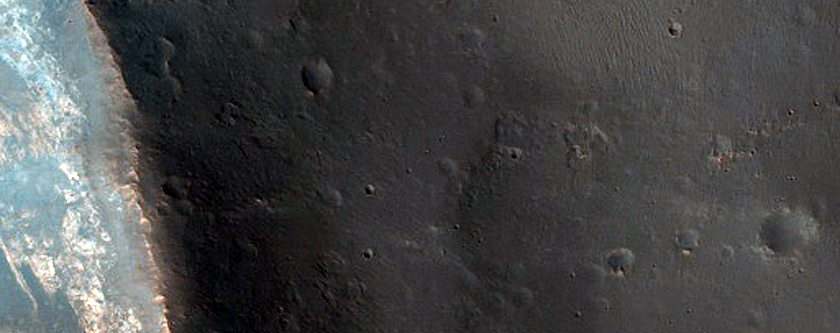 Light-Toned Material and Crater Layering near Trouvelot Crater