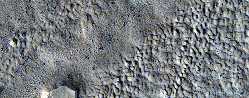 Boulders on Lobate Debris Apron Associated with Ice Flow Convergence