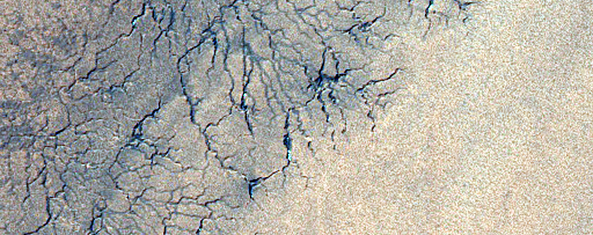 Spiders Along Polar Layered Deposits Outlier on Ejecta Blanket