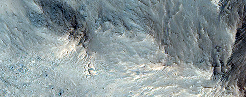 Slope Features on Orson Welles Crater Wall
