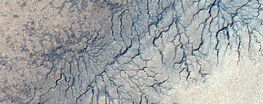 Spiders Along Polar Layered Deposits Outlier on Ejecta Blanket