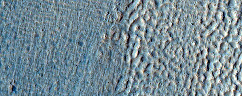 Crater with Ice Deposit Plus Rim Erosion and Gullies