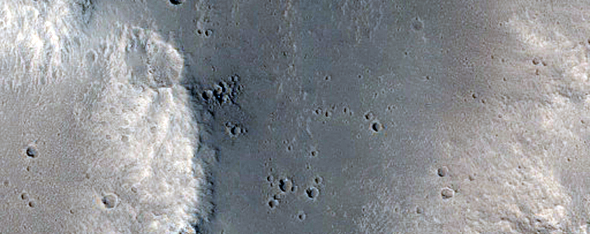 Impact Crater with Preserved Ejecta in Cratered Plains