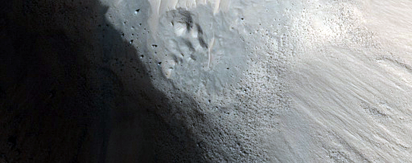 Crater-Related Pitted Materials in 3-Kilometer Crater in Nepenthes Planitia
