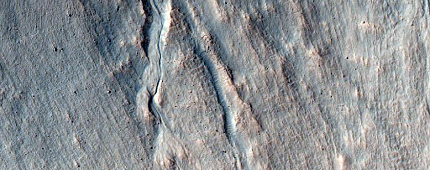 Triangular Scars on Hillslopes