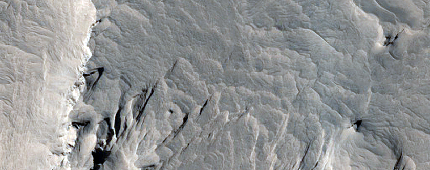 Layered Bedrock and Yardangs in Degraded Arabia Terra Crater