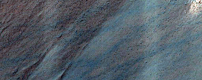Triangular Scars on Hillslopes