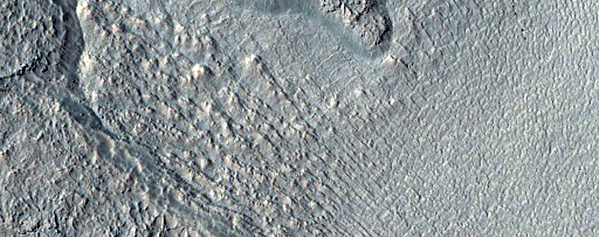 Gullies and Flow Features along Crater Wall in Promethei Terra
