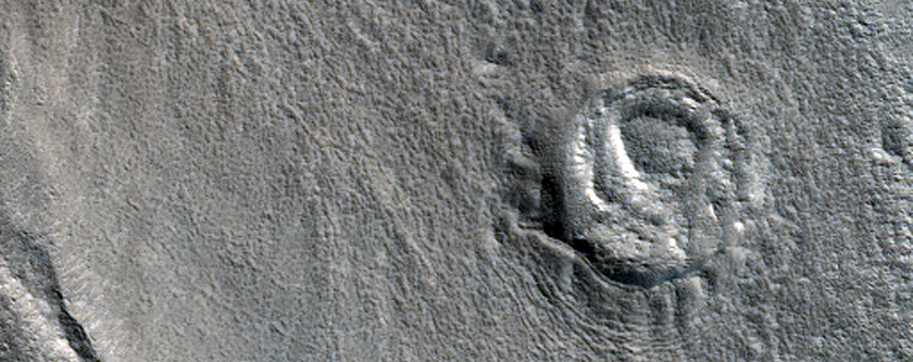 Crater in Galaxias Fossae