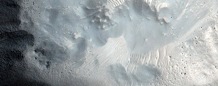 Crater-Related Pitted Materials in 3-Kilometer Crater in Nepenthes Planitia