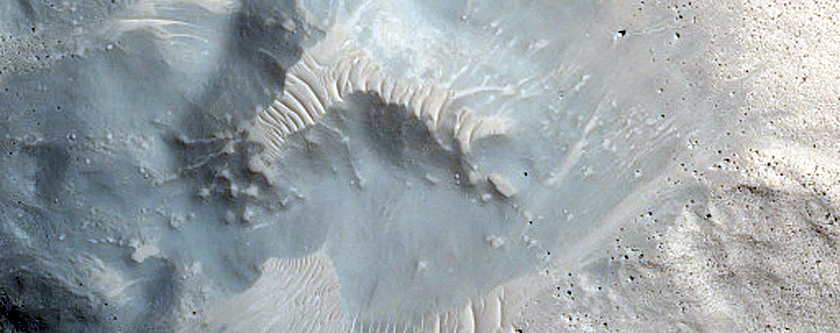 Crater-Related Pitted Materials in 3-Kilometer Crater in Nepenthes Planitia
