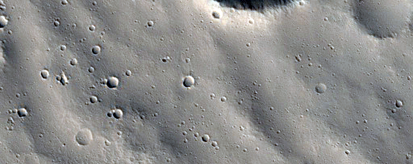 Channels Cutting across Troughs in Labeatis Fossae