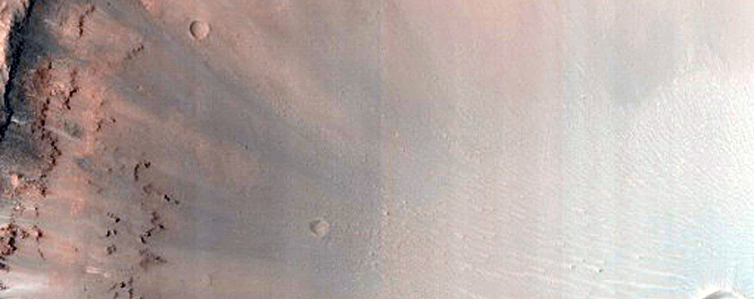 Well-Exposed Diverse Bedrock Associated with Crater off Her Desher Vallis