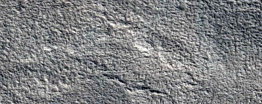 North-Pole-Facing Deposit in Crater Associated with Headwall Erosion