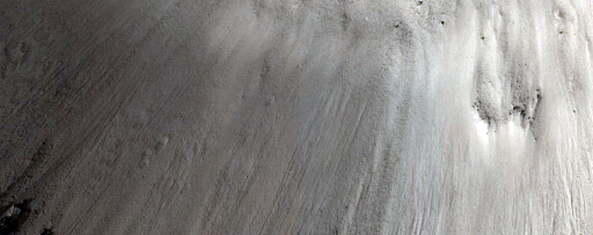 Crater-Related Pitted Materials in 3-Kilometer Crater in Elysium Planitia