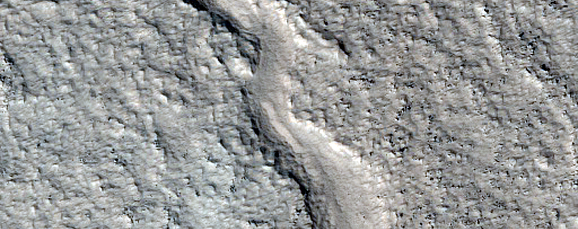 Curved Channel West of Moreux Crater