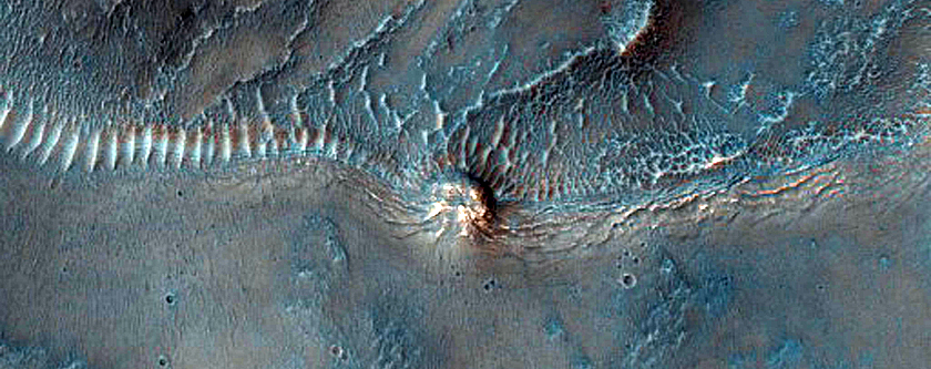 Layers and Bench in Crater in Thaumasia Planum