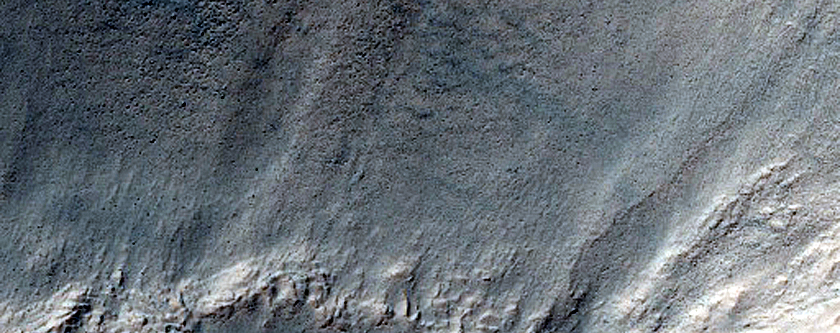 Triangular Scars on Hillslopes