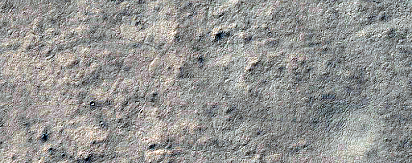 Candidate New Impact Site with Possible Ice