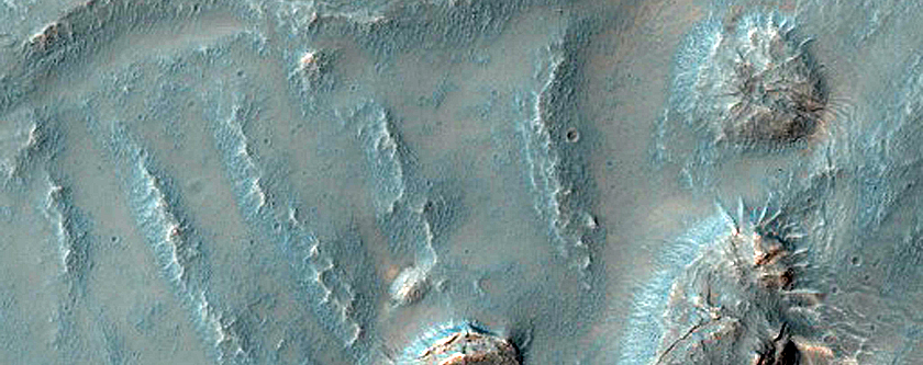 Layers and Bench in Crater in Thaumasia Planum