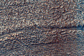 Curved Surface Features in Hellas Planitia