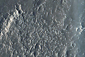 Layers in Depression on Crater Floor in Northern Mid-Latitudes