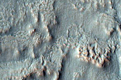 Triangular Scars on Hillslopes