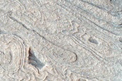 Curved Bands in Hellas Planitia