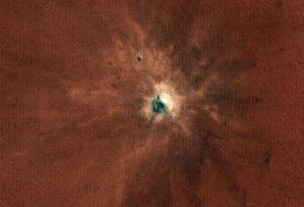 A New Impact Crater Exposes Bright Material
