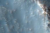 Impact Related Deposits and Flows Northeast of Hellas Planitia