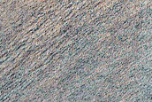Triangular Scars on Hillslopes