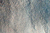 Triangular Scars on Hillslopes