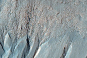 Possible Gully-Associated Light-Toned Materials near Simois Colles