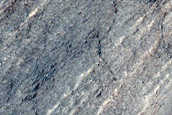 Triangular Scars on Hillslopes