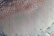 Light-Toned Layers Exposed in Crater on Terra Sirenum Crater Floor