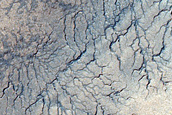 Spiders Along Polar Layered Deposits Outlier on Ejecta Blanket