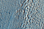 Crater with Ice Deposit Plus Rim Erosion and Gullies