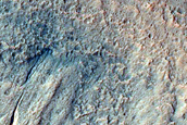 Possible Gully-Associated Light-Toned Materials in Artik Crater