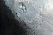 Crater-Related Pitted Materials in 3-Kilometer Crater in Nepenthes Planitia