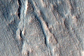 Triangular Scars on Hillslopes