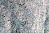 Triangular Scars on Hillslopes