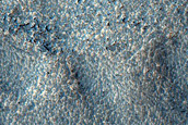 Channel Eroding Crater in Southern Mid-Latitudes