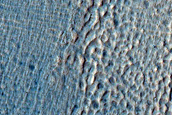 Crater with Ice Deposit Plus Rim Erosion and Gullies