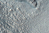 Gullies and Flow Features along Crater Wall in Promethei Terra